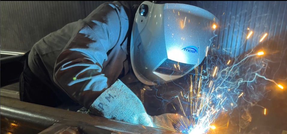 Welding a steel frame in our workshop